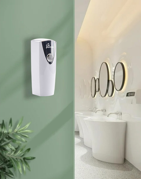 Puress fragrance dispenser on a green wall. Puress fragrance dispenser on a green wall.